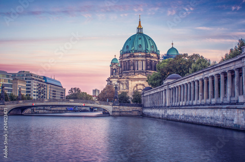 Fototapeta Naklejka Na Ścianę i Meble -  Looking across the river at the Berlin Cathedral during a colorful sunset 