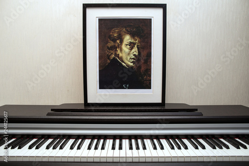 11.28.2018, Moscow, Russia. Fryderyk Chopin - Photocopy of portrait painted by Ferdinand Victor Eugène Delacroix in 1838 and piano keyboard.  photo