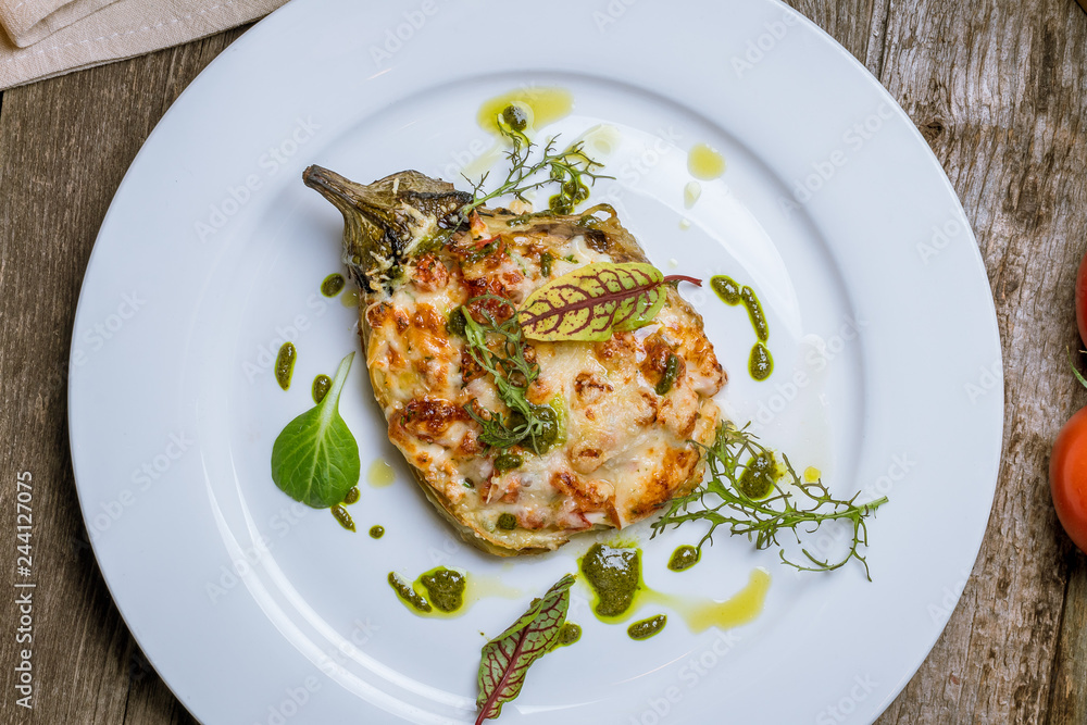 baked eggplant on plate with parmesan baked eggplant on plate with parmesan
