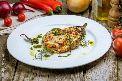 baked eggplant on plate with parmesan