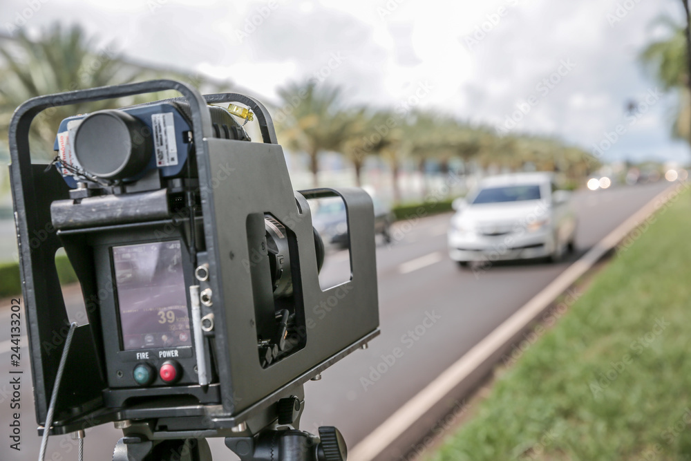 Police radar installed near the road to control the speed limit. Police radar installed near the road to control the speed limit.