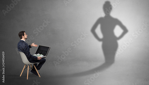 Rich businessman staying and offering stuffs to a pretty shadow woman
