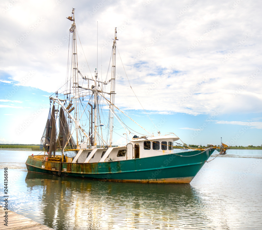 Nautical shrimp fishing boat Gulf of Mexico harbor sailing for marine life in sea Nautical shrimp fishing boat Gulf of Mexico harbor sailing for marine life in sea