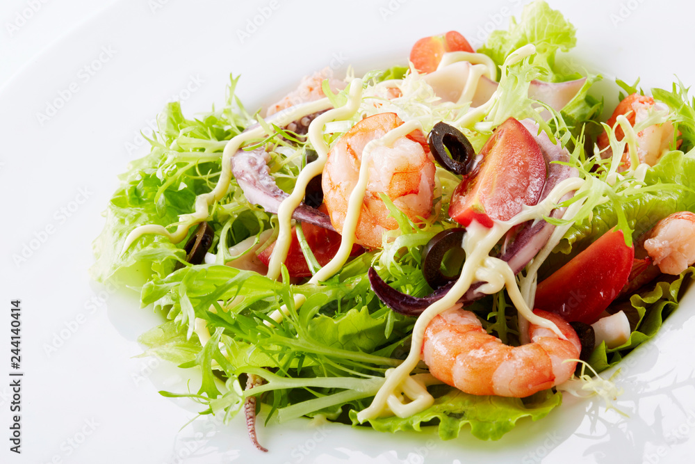 Delicious seafood salad on a white background Delicious seafood salad on a white background