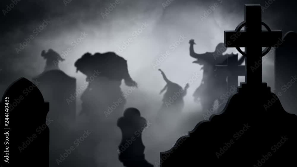 Zombie Silhouettes in a Foggy Graveyard 4k Loop features zombie silhouettes walking toward the viewer in a foggy graveyard