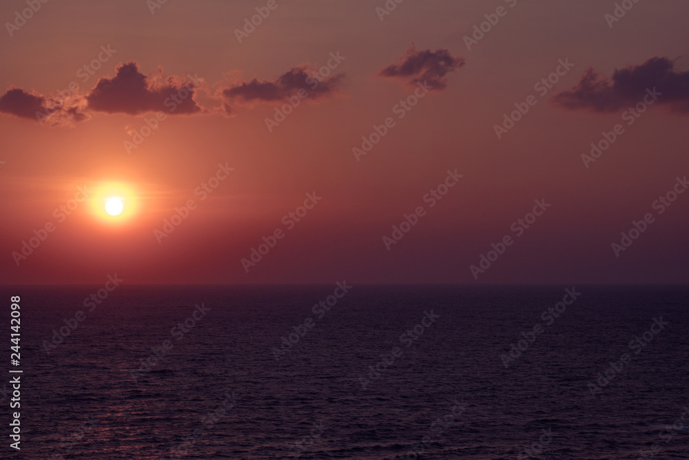 Scenic orange sunset sky background, scenic orange sunrise, relaxing seascape with wide horizon.