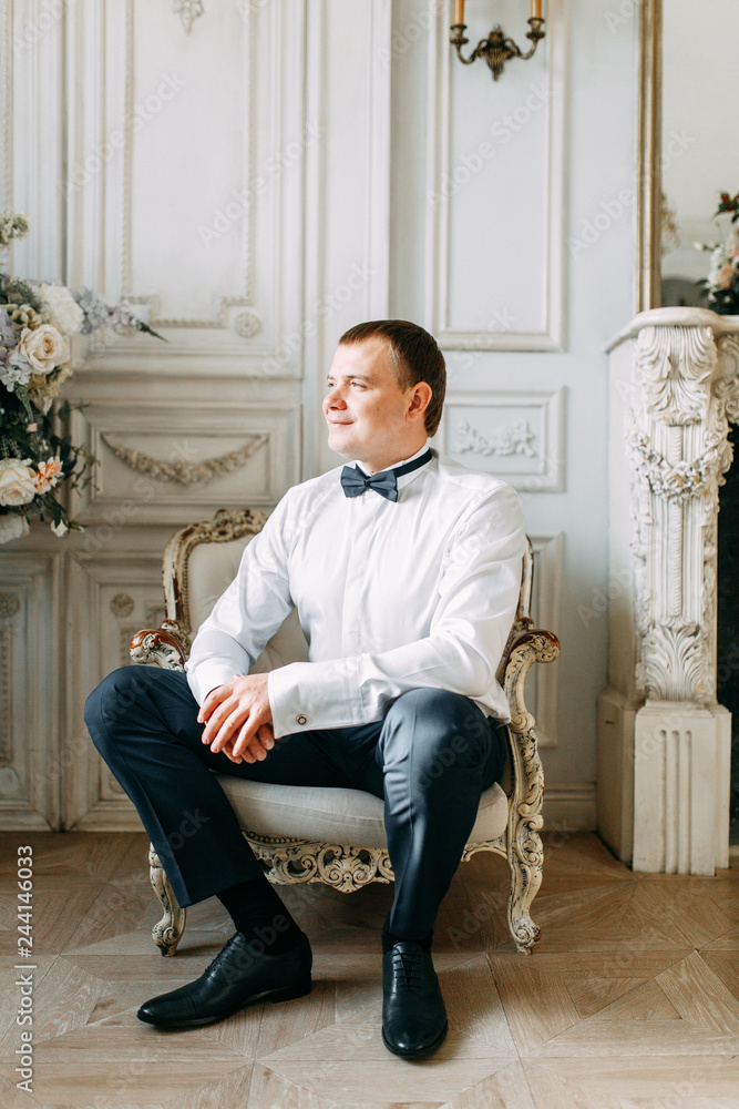 The preparations of the groom in a Deluxe hotel. the man in the shirt and jacket. The preparations of the groom in a Deluxe hotel. the man in the shirt and jacket.