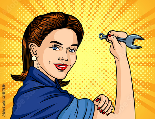 Color vector illustration in pop art style. The girl with a spanner in her hand over halftone background. Poster for the International Labor Day. Beautiful girl in a working form keeps the wrench