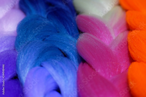 Kanekalon. Colored artificial strands of hair. Material for plaiting braids photo