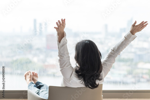 Slika na platnu Happy life-work balance of business Asian woman relaxing in hotel living room