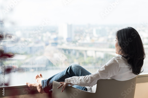 Obraz na plátně Simple healthy living lifestyle menopause aged Asian woman take a rest relaxing