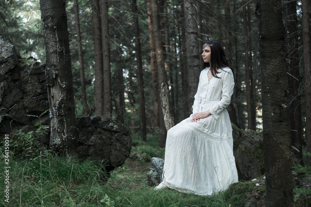 beautiful young sexy girl walks and rests in a fairy forest, she has a white gentle dress and a tiara in her hair, she looks like an unearthly nymph, light and graceful, trees are juicy mint-colored beautiful young sexy girl walks and rests in a fairy forest, she has a white gentle dress and a tiara in her hair, she looks like an unearthly nymph, light and graceful, trees are juicy mint-colored