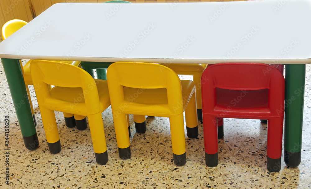 inside a school classroom of a kindergarten with small plastic c