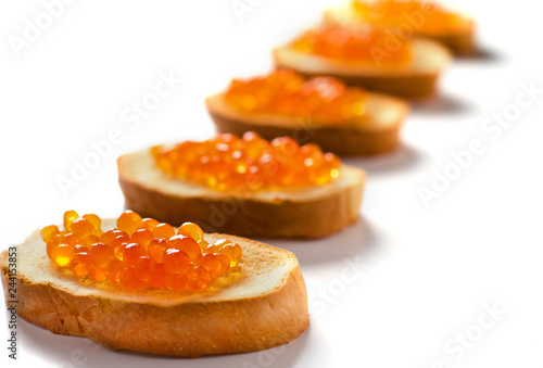 Sandwiches with red caviar of salmon fishes. Copy space. Selective focus