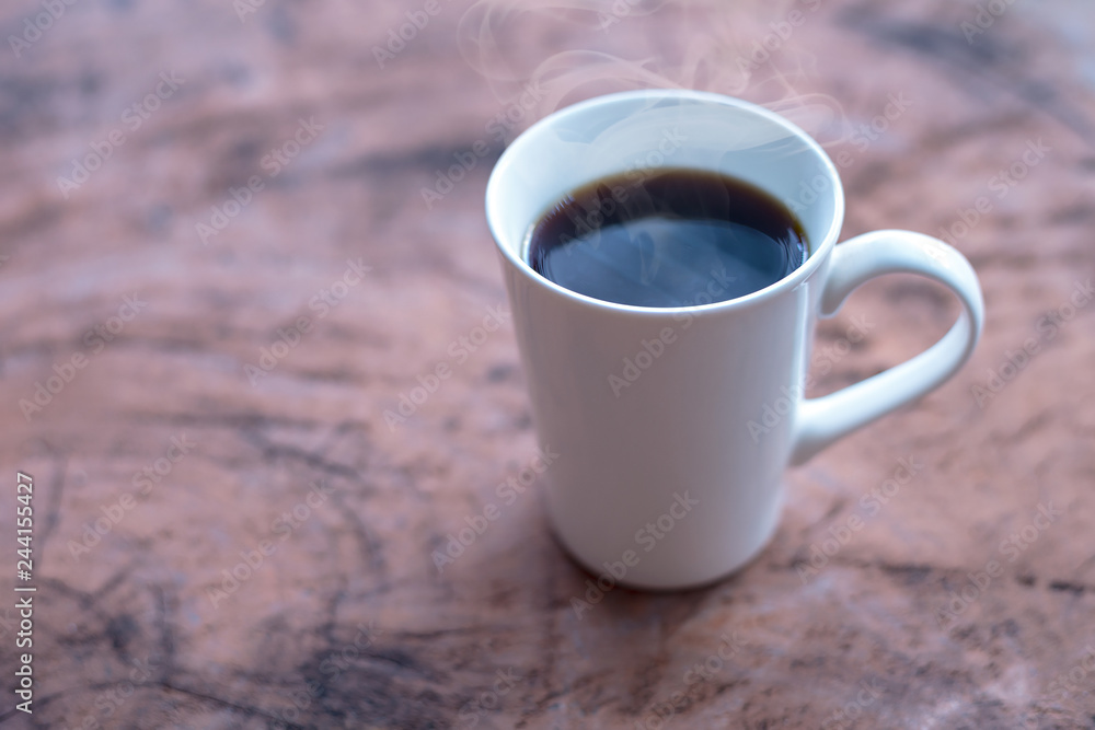 Hot coffee in a white cup on the table Hot coffee in a white cup on the table