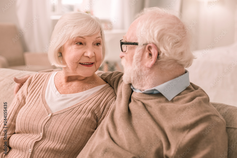 Charming grey-haired male person staring at his partner Charming grey-haired male person staring at his partner