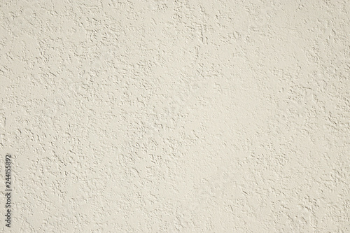 roughcast plaster wall background texture in off-white photo