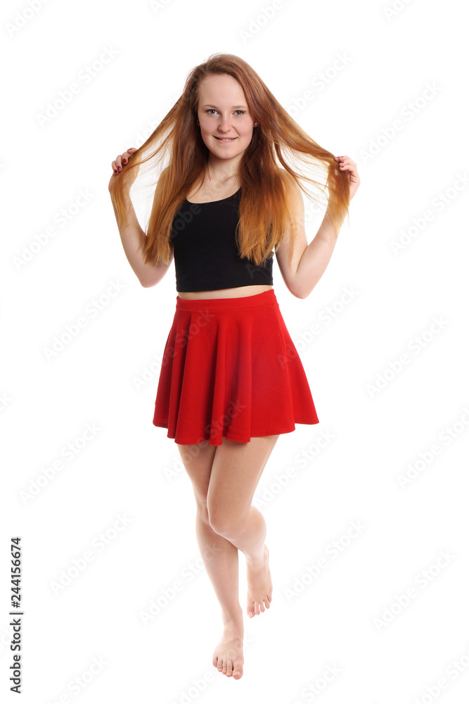 full body shot of young woman wearing red mini skirt playing with hair  Stock Photo | Adobe Stock