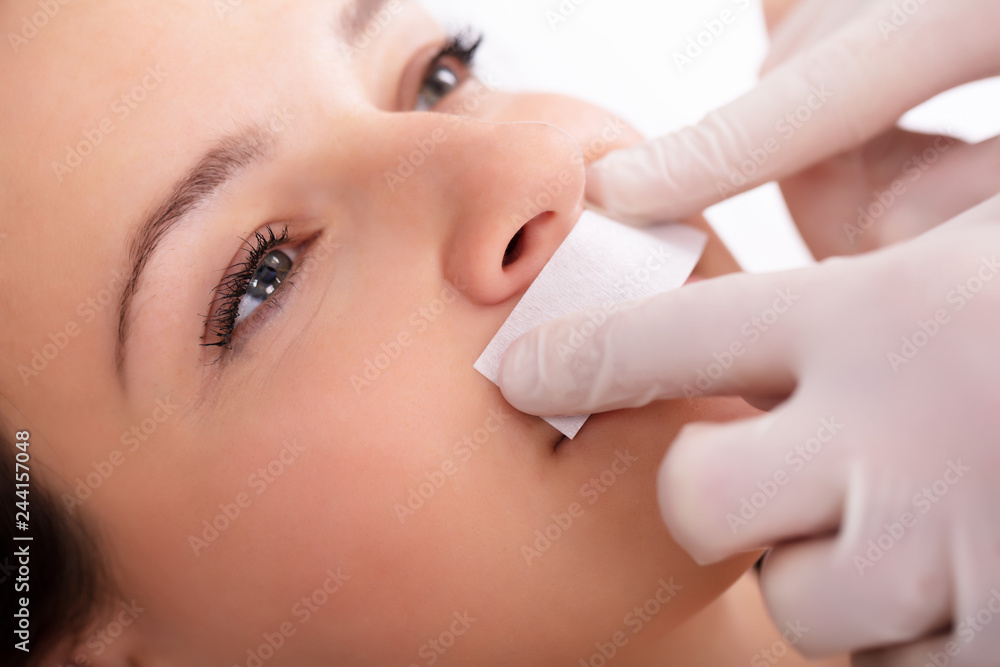 Therapist Waxing Woman's Upper Lip