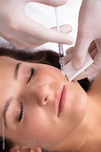 Woman Having Aesthetic Treatment At Beauty Clinic