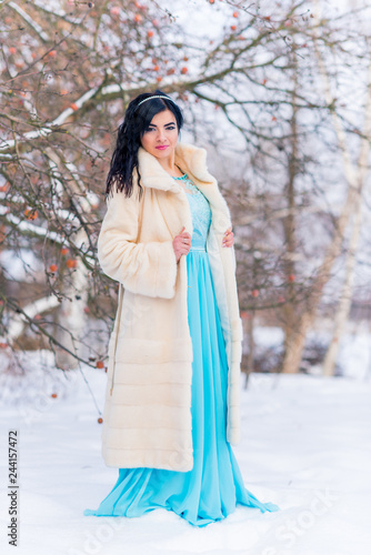 Cold season concept, fashionable arabic woman in fur coat, fashion for lady