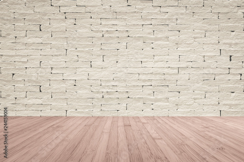 Brick wall painted in cream beige color with wooden floor textured background in red brown