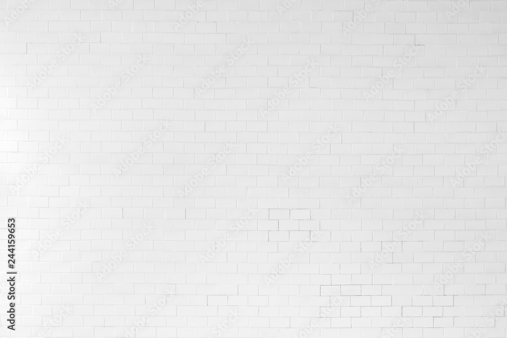 White painted old aged brick tile wall texture background White painted old aged brick tile wall texture background