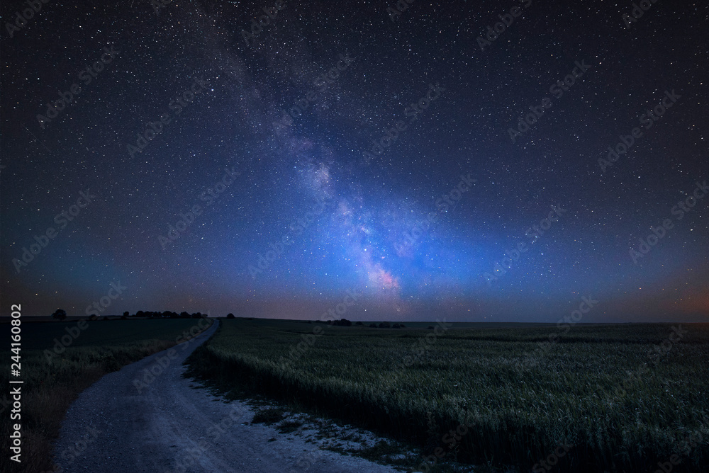 Vibrant Milky Way composite image over landscape of Steyning Bowl on South Downs Vibrant Milky Way composite image over landscape of Steyning Bowl on South Downs