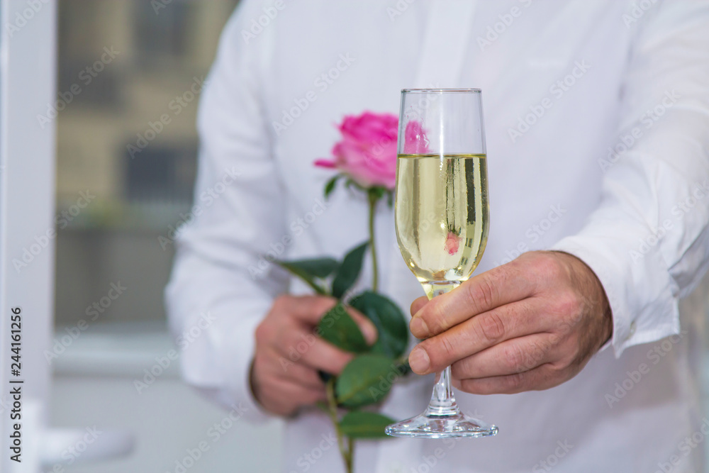 Valentine's day, man with red rose and glass of champagne, romantic surprise. Valentine's day, man with red rose and glass of champagne, romantic surprise.