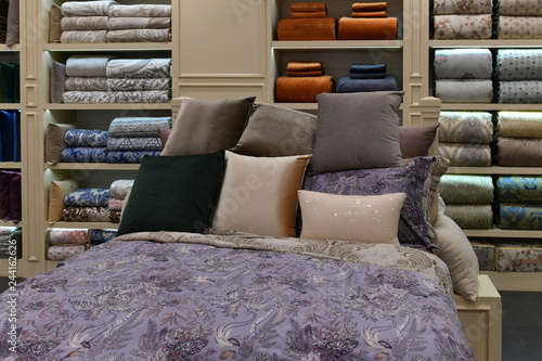 Bed with pillows in the interior of the store