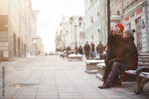 Young couple walking through the winter © alexkich