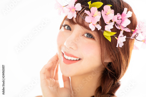 closeup young smiling beauty face with flower