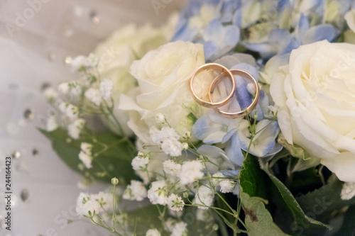 Bridal bouquet and wedding rings.