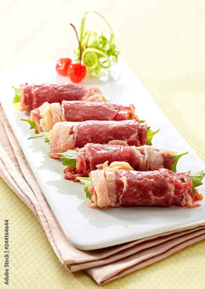 Delicious Chinese cuisine, raw beef rolls Delicious Chinese cuisine, raw beef rolls