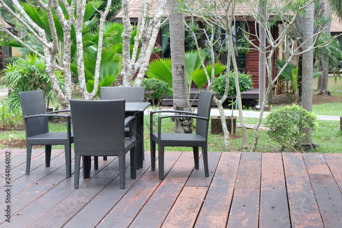 Table and chairs in front of the balcony.