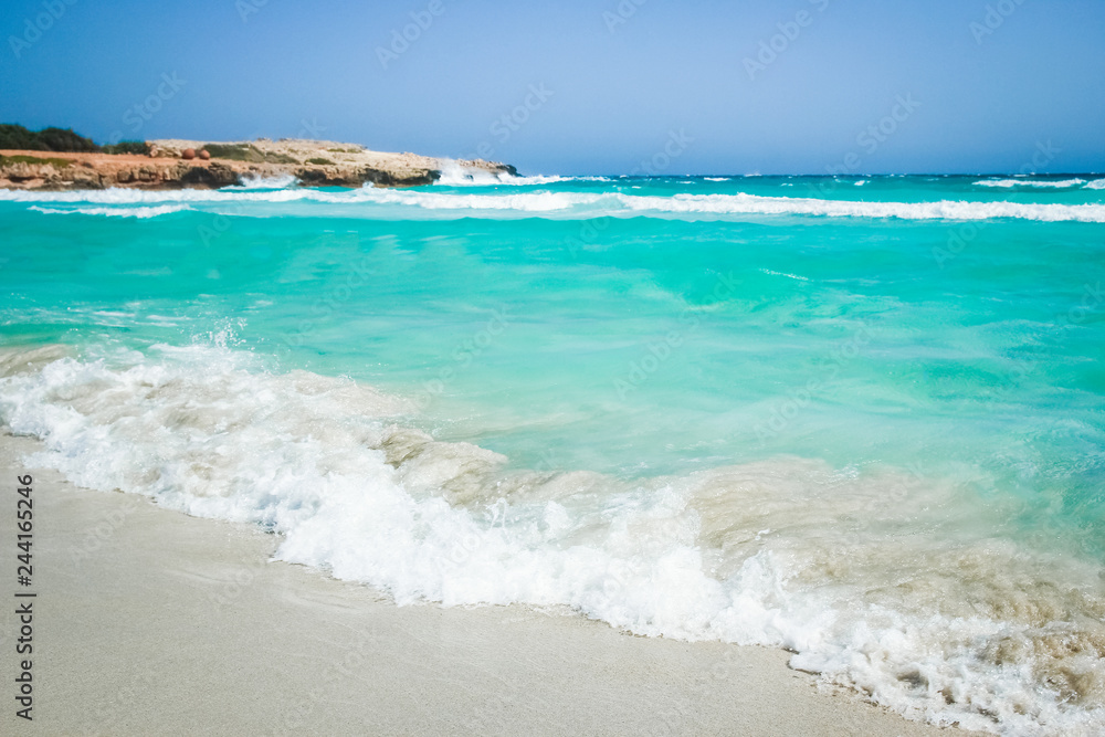 beautiful beach with waves in the nature of the background
