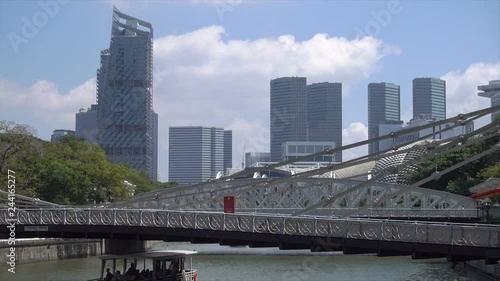 Tour boat and Cavenagh Bridge, Boat Quay, Singapore photo