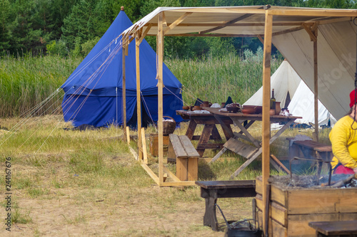 Festival of medieval military culture. Place for rest and meal between the battles in a medieval camp, reconstruction. photo