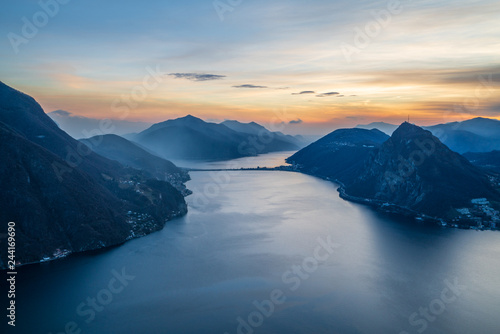 Scenic sunset over Lake Lugano in swiss Alps, Ticino, Switzerland