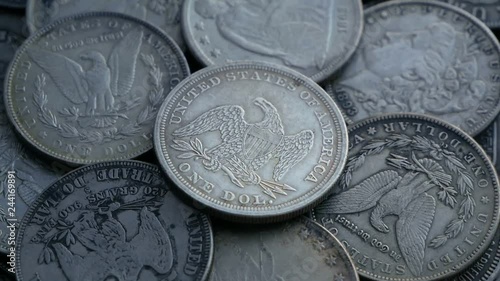 Pile Of One Dollar Coins. Collection of old coins Dollars. Financial Concept. Coins spin in a circle. A Bunch of One-Dollar Silver Coins