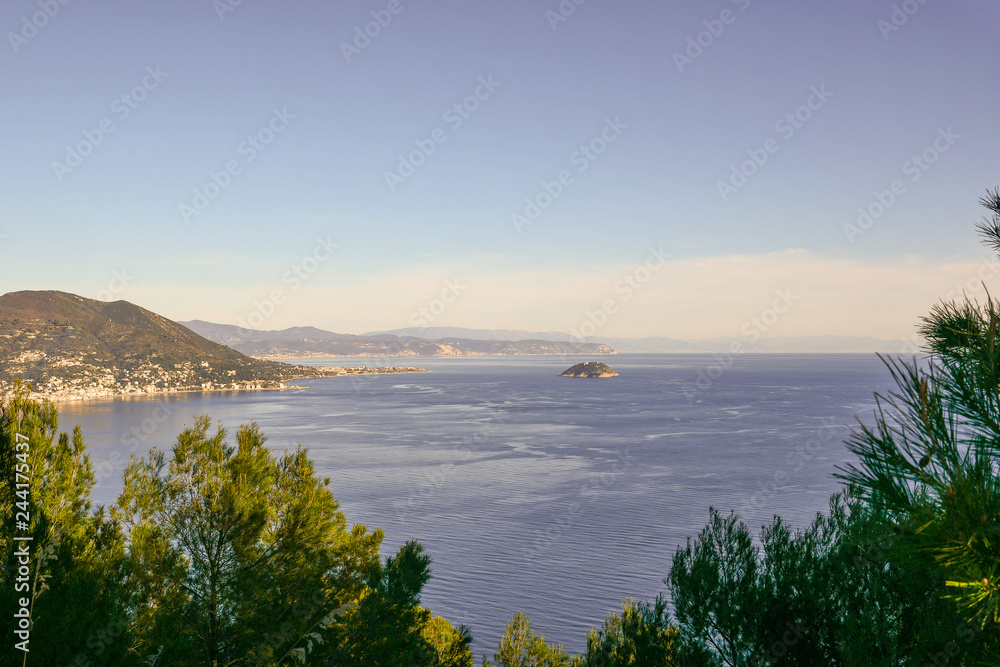 Panoramic view of the Ligurian coast with Alassio, Albenga and the Gallinara Island from the cape of Capo Mele, Liguria, Italy