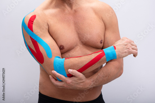 Fotografia Man With Physio Tape On His Hand