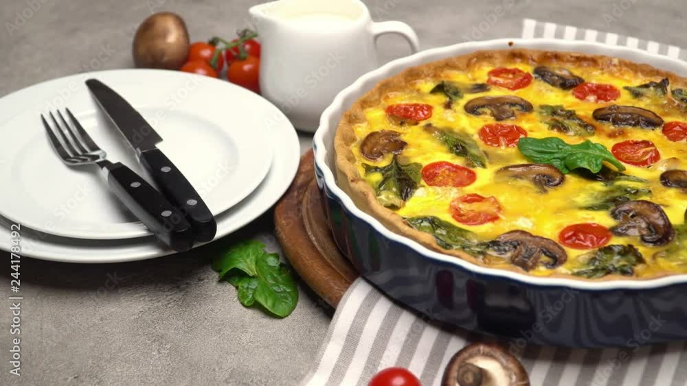 Baked homemade quiche pie in ceramic baking form Baked homemade quiche pie in ceramic baking form