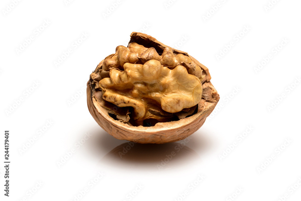 Open ripe walnut with full kernel, close up macro, isolated on a white background.