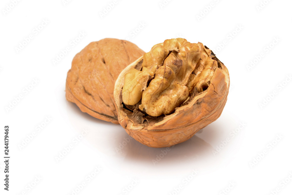 Open ripe walnut, with kernel and shell, close up macro, isolated on a white background. Open ripe walnut, with kernel and shell, close up macro, isolated on a white background.