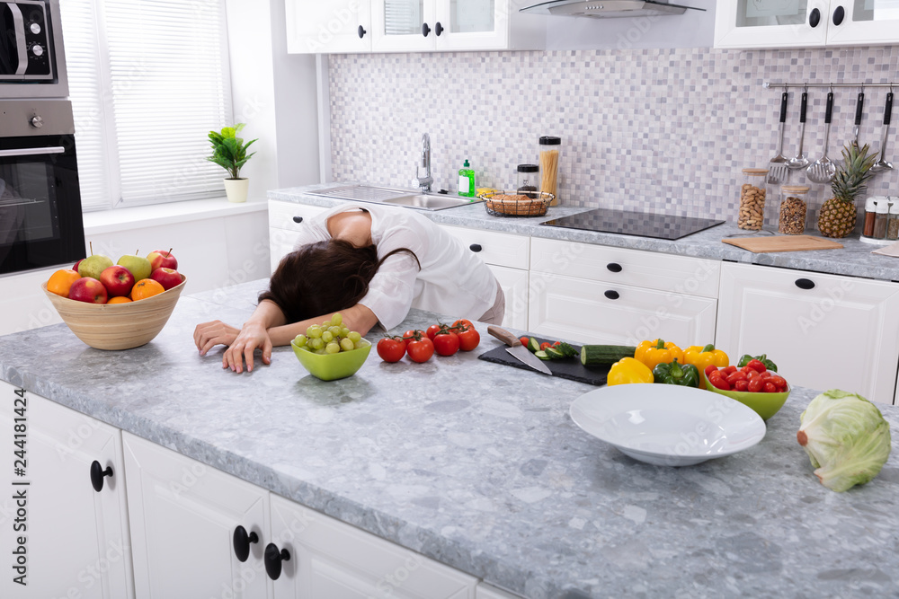 Tired Woman Sleeping On Kitchen Counter Tired Woman Sleeping On Kitchen Counter