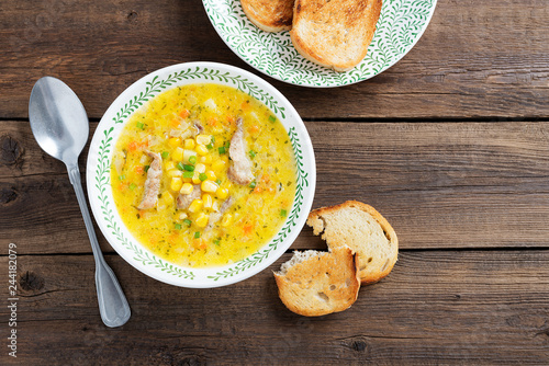 Creamy corn soup with vegetables and meat. 