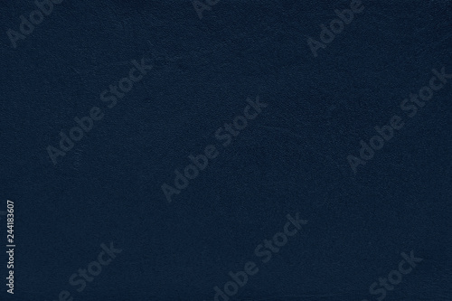Deep blue leather background.
