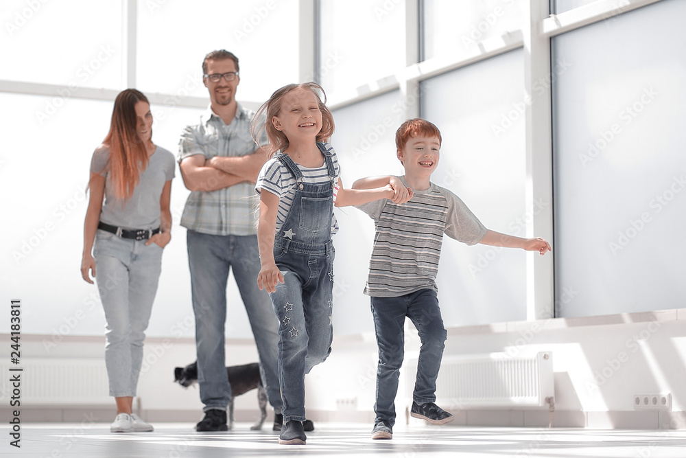 happy family standing in new spacious apartment