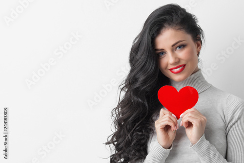 Woman showing paper heart
